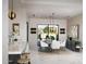 Elegant dining room with large windows and modern light fixtures at 29646 N 109Th Pl # 128, Scottsdale, AZ 85262