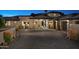 Stunning home exterior with stone accents and a large driveway at 29646 N 109Th Pl # 128, Scottsdale, AZ 85262