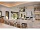 Open floor plan with expansive kitchen island, and Gathering room with fireplace at 29646 N 109Th Pl # 128, Scottsdale, AZ 85262