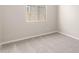Simple bedroom with neutral walls and grey carpet at 40347 W Wade Dr, Maricopa, AZ 85138