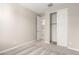 Well-lit bedroom with closet and access to bathroom at 40347 W Wade Dr, Maricopa, AZ 85138