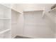 Spacious closet with double hanging rods and shelving at 40347 W Wade Dr, Maricopa, AZ 85138