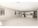 Spacious living room with tile flooring and access to backyard at 40347 W Wade Dr, Maricopa, AZ 85138