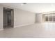 Bright living room with tile floors and sliding glass doors to backyard at 40347 W Wade Dr, Maricopa, AZ 85138