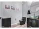 Stylish powder room with glass vessel sink and dark vanity at 16 W Encanto Blvd # 112, Phoenix, AZ 85003