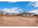 Large unlandscaped backyard with perimeter block fencing, offering privacy and customization opportunities at 18812 E Elizar Dr, Gold Canyon, AZ 85118