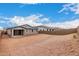 Expansive backyard awaiting your personal touch, featuring secure block wall fencing and open space at 18812 E Elizar Dr, Gold Canyon, AZ 85118