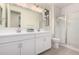 Modern bathroom features a double sink vanity, subway tile shower, and a glass shower door at 18812 E Elizar Dr, Gold Canyon, AZ 85118