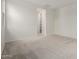 Spacious bedroom featuring neutral walls and carpeted floors with an open doorway to a walk-in closet at 18812 E Elizar Dr, Gold Canyon, AZ 85118