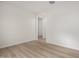 Bright bedroom featuring wood-look flooring, a neutral color palette, and ample natural light at 18812 E Elizar Dr, Gold Canyon, AZ 85118