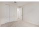 Clean bedroom features neutral walls, carpeted floors, and a closet with sliding doors at 18812 E Elizar Dr, Gold Canyon, AZ 85118