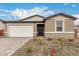 Charming single-story home with a two-car garage and low-maintenance desert landscaping at 18812 E Elizar Dr, Gold Canyon, AZ 85118