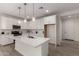 Bright and modern kitchen with white cabinets, stainless steel appliances, and a large kitchen island at 18812 E Elizar Dr, Gold Canyon, AZ 85118