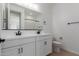 Clean bathroom with double vanity and updated fixtures at 40461 W Wade Dr, Maricopa, AZ 85138