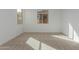 Spacious bedroom featuring neutral walls and carpeted floors at 40461 W Wade Dr, Maricopa, AZ 85138