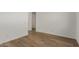 Bright bedroom with wood-look floors and neutral walls at 40461 W Wade Dr, Maricopa, AZ 85138