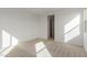 Bright bedroom with carpet flooring and ample closet space at 40461 W Wade Dr, Maricopa, AZ 85138