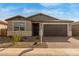 Single-story home with attractive stone and neutral siding at 40461 W Wade Dr, Maricopa, AZ 85138