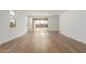 Bright and airy living room with hardwood floors and access to backyard at 40461 W Wade Dr, Maricopa, AZ 85138