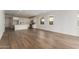 Spacious living area with hardwood floors and sliding glass doors at 40461 W Wade Dr, Maricopa, AZ 85138