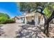 Covered patio, grassy area, and mature trees in the backyard at 6145 E Sierra Morena St, Mesa, AZ 85215