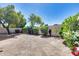 Landscaped backyard with desert plants and grass at 6145 E Sierra Morena St, Mesa, AZ 85215