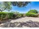 Landscaped backyard with desert landscaping and shrubs at 6145 E Sierra Morena St, Mesa, AZ 85215