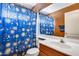 Bathroom with single sink vanity and shower/tub combo at 6145 E Sierra Morena St, Mesa, AZ 85215
