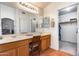 Double vanity bathroom with ample storage and a walk-in closet at 6145 E Sierra Morena St, Mesa, AZ 85215
