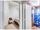Guest bedroom with a chair and access to a bathroom at 6145 E Sierra Morena St, Mesa, AZ 85215