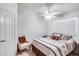 Bright bedroom with a queen-size bed and ceiling fan at 6145 E Sierra Morena St, Mesa, AZ 85215