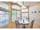 Bright breakfast nook with a glass-top table and four chairs at 6145 E Sierra Morena St, Mesa, AZ 85215