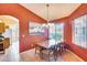Charming dining room with a wooden table and chairs, and access to kitchen at 6145 E Sierra Morena St, Mesa, AZ 85215