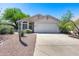 Single-story home with a landscaped front yard and attached garage at 6145 E Sierra Morena St, Mesa, AZ 85215