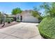 House exterior showcasing a well-maintained front yard at 6145 E Sierra Morena St, Mesa, AZ 85215