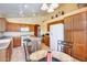 Spacious kitchen featuring wood cabinets, an island, and modern appliances at 6145 E Sierra Morena St, Mesa, AZ 85215
