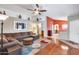 Spacious living room featuring a large sectional sofa and hardwood floors at 6145 E Sierra Morena St, Mesa, AZ 85215