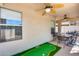 Patio with seating area, putting green, and ceiling fans at 6145 E Sierra Morena St, Mesa, AZ 85215