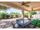 Covered patio with seating area and putting green at 6145 E Sierra Morena St, Mesa, AZ 85215
