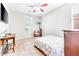 Secondary bedroom with tiled floors and a ceiling fan at 29110 N 129Th Ave, Peoria, AZ 85383