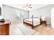 Spacious bedroom with a wooden post bed and tiled floors at 29110 N 129Th Ave, Peoria, AZ 85383