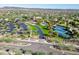 Aerial view of community amenities including tennis courts and parking lot at 29110 N 129Th Ave, Peoria, AZ 85383