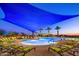 Relaxing community pool with shade structures and lounge chairs at 29110 N 129Th Ave, Peoria, AZ 85383