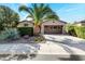 Single-story home with a two-car garage and desert landscaping at 29110 N 129Th Ave, Peoria, AZ 85383