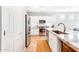 Modern kitchen with white cabinets, granite countertops and island at 29110 N 129Th Ave, Peoria, AZ 85383