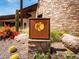 Photo of Kiva Club sign featuring a unique logo and stonework at 29110 N 129Th Ave, Peoria, AZ 85383