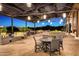Spacious outdoor patio with seating and fire pit at 29110 N 129Th Ave, Peoria, AZ 85383