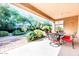 Covered patio with seating area and access to backyard at 29110 N 129Th Ave, Peoria, AZ 85383