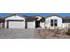 Charming single-Gathering home featuring a three car garage and low-maintenance desert landscaping at 12312 W Luxton Ln, Avondale, AZ 85323
