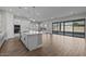 Open-concept kitchen featuring an island, stainless appliances, and access to the living and dining areas at 12312 W Luxton Ln, Avondale, AZ 85323